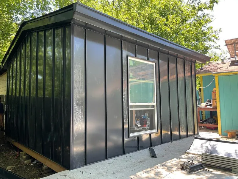 Black standing seam metal wall panels for Roof Inspection in Minneola